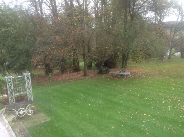 Photo 7(c) - looking out of a bedroom window over the front lawn, garden and Footpath ER183